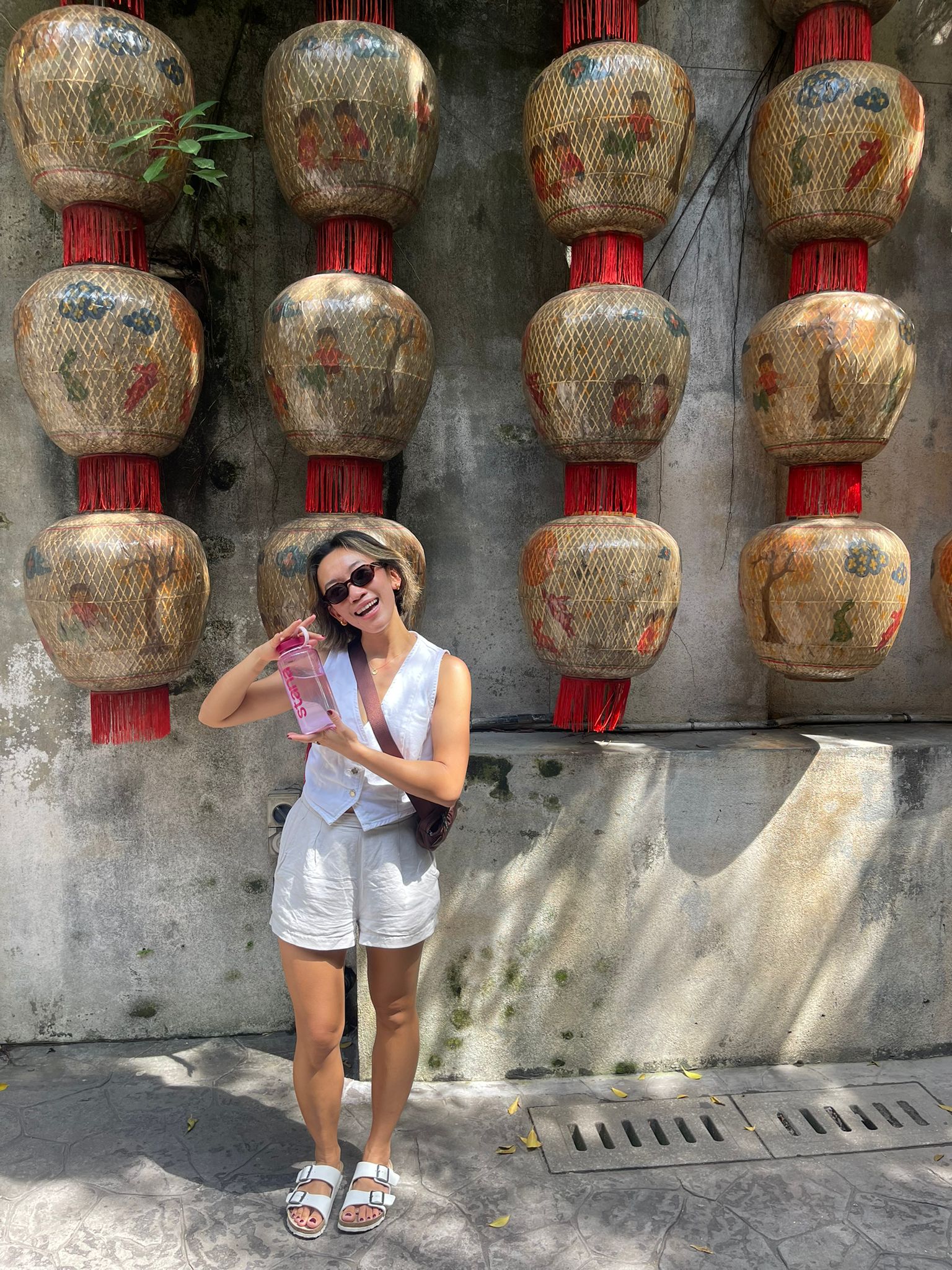 Girl in sunglasses with Stana water bottle